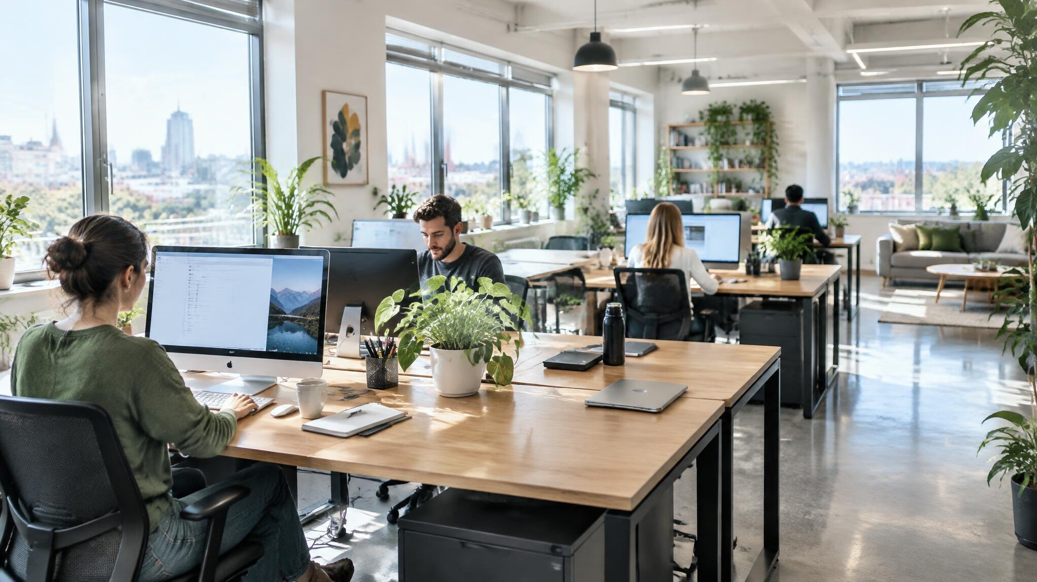 Bright modern office interior with desks and plants
